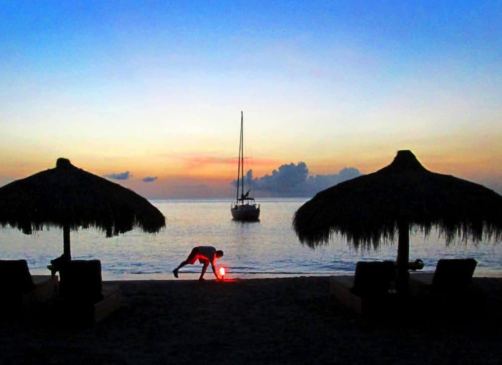Setting Up Torches for Sunset Anse Chastanet Beach. Saint Lucia.