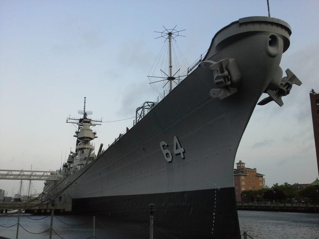 USS Wisconsin towers over Norfolk's waterfront.