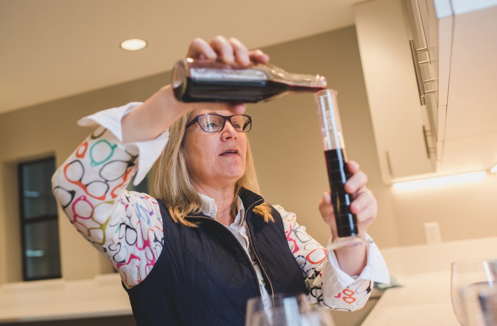 Wine maker Pam Starr busy at work. FWT Magazine.