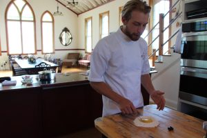 Roark MacKinnon making pasta by hand.