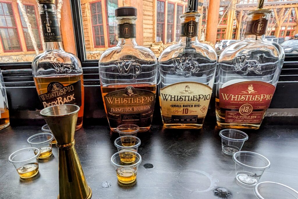WhistlePig products with plastic tasting cups