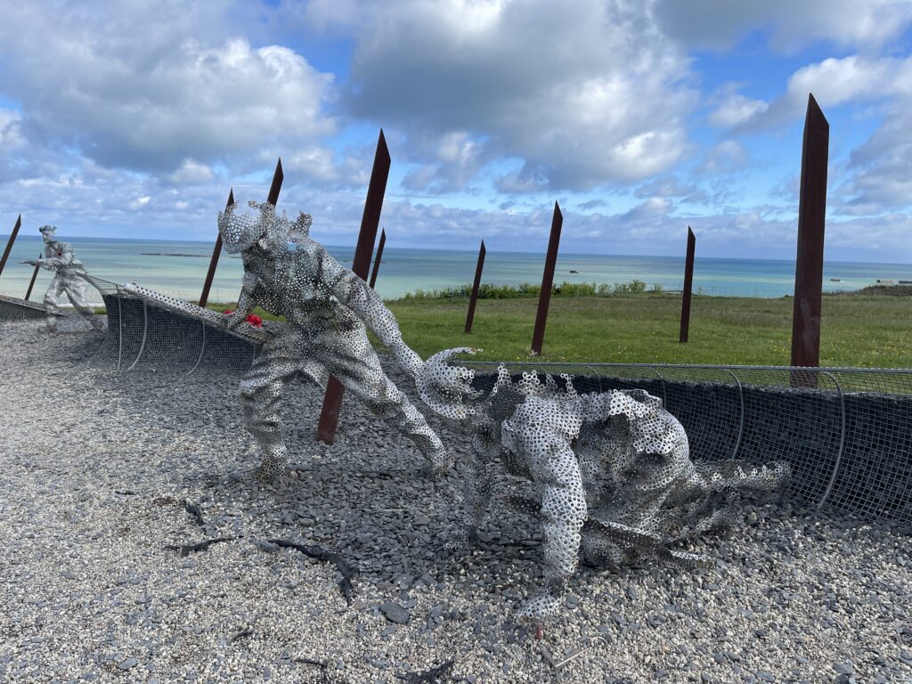An iron sculpture of two soldiers in Normandy, France