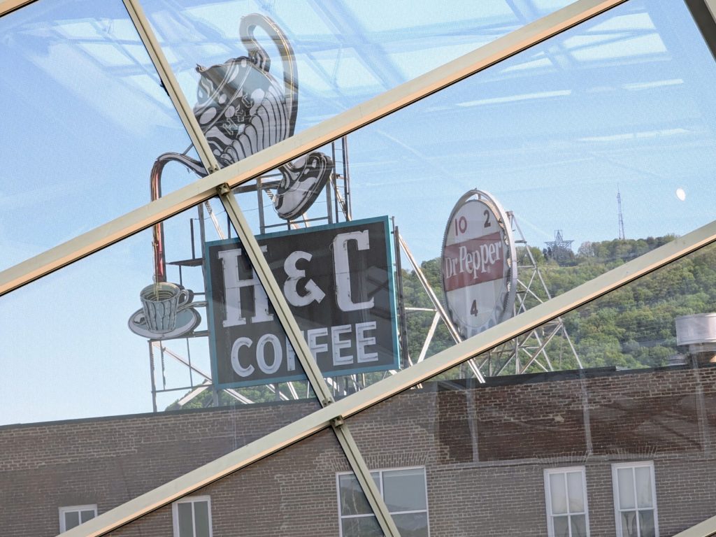 The H&C Coffee and Dr Pepper Signs viewed from the atrium of the Roanoke art museum