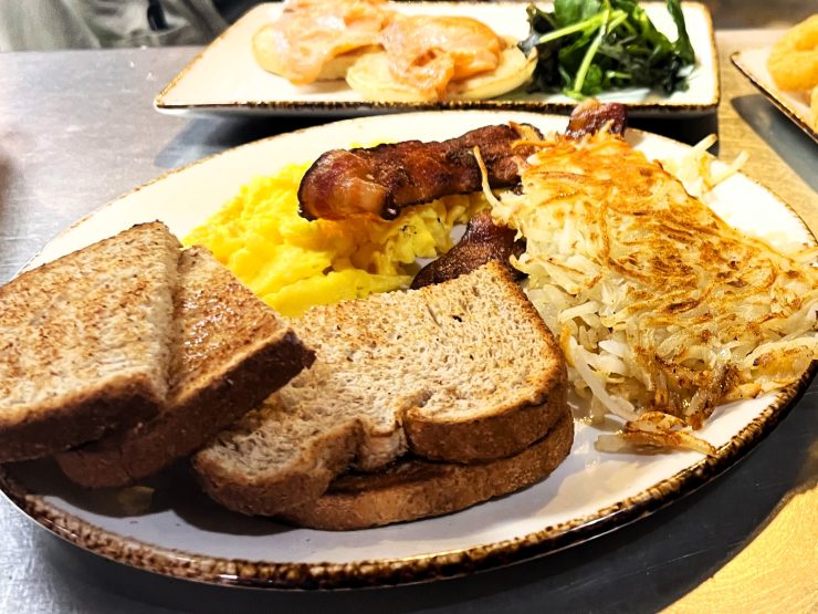 Breakfast of toast, bacon, eggs, and hash browns at the After 26 Depot Cafe