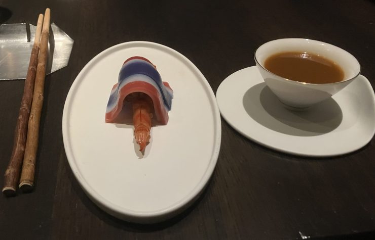 Potong Restaurant's Pad Thai - A single shrimp covered by striped red, white and blue rice noodle.