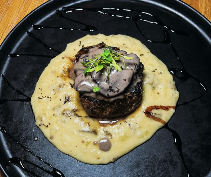 A beautifully plated dish from Mutuo in San Juan, Puerto Rico, featuring locally inspired modern cuisine.