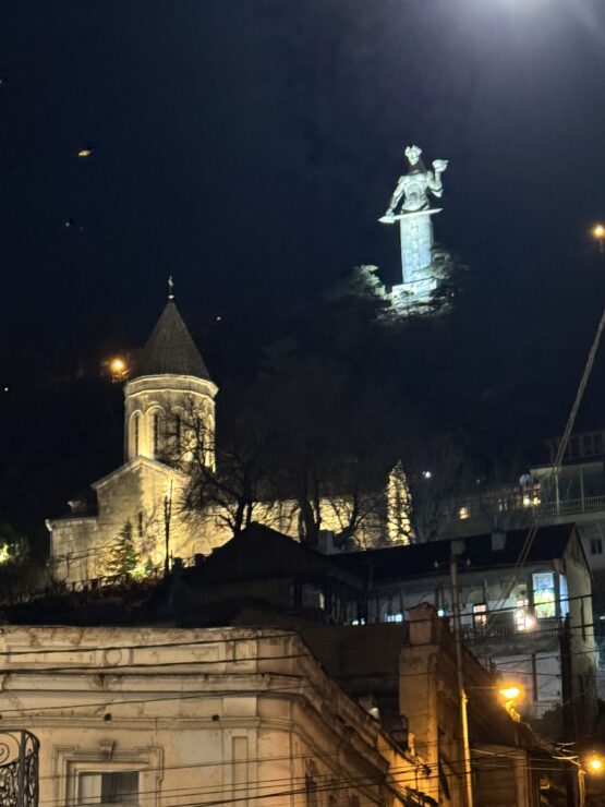 Kartlis Deda or Mother of Georgia stands on a hill overlooking Tbilisi. She symbolises the Georgian spirit holding a cup of wine in her left hand to welcome friends, and a sword in her right to ward off enemies