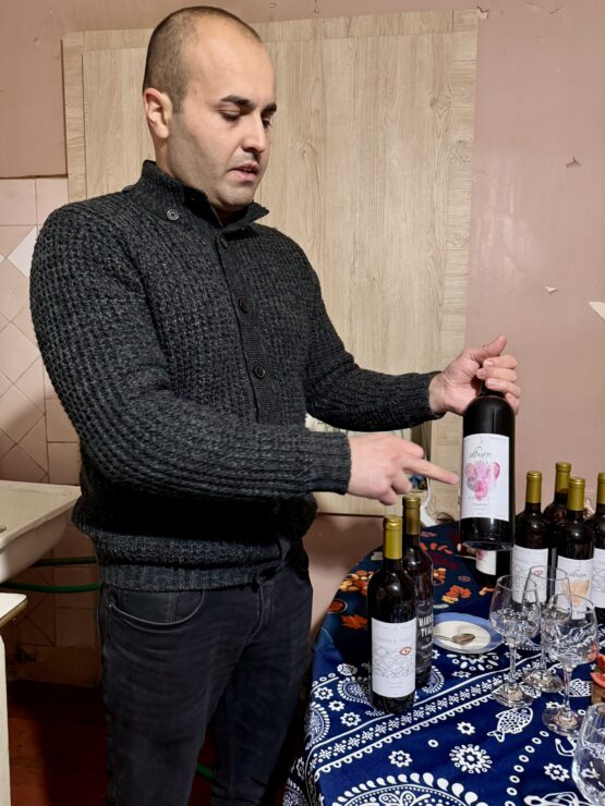 Bacho showing us his family wines on his kitchen table at the winery.