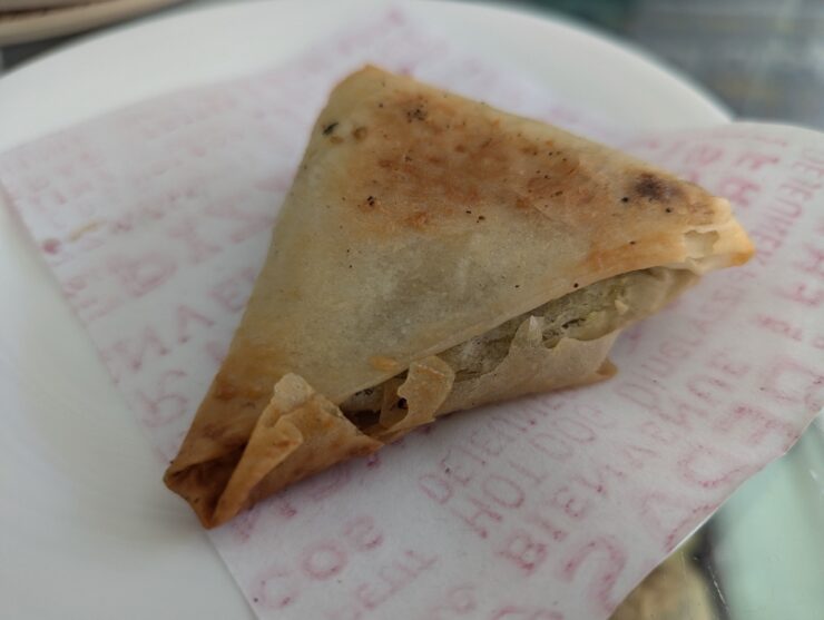Triangular shaped flaky pastry with savory filling.