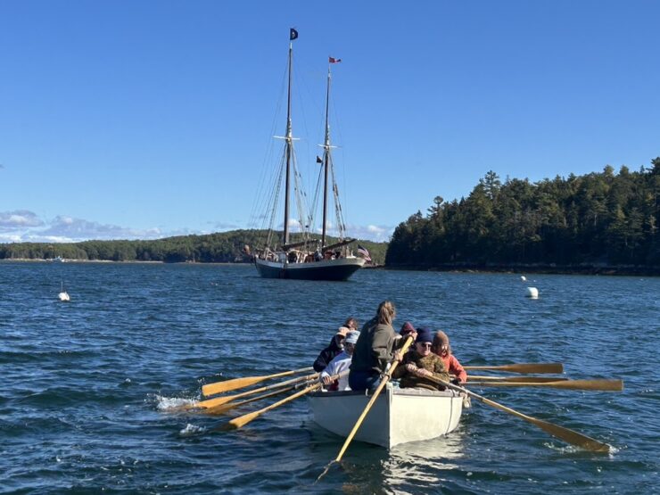 Rowing to shore from the windjammer Angelique