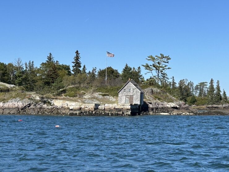 An old shack view from the water on board of the Angelique