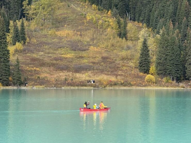 Canoe on bright blue lake.