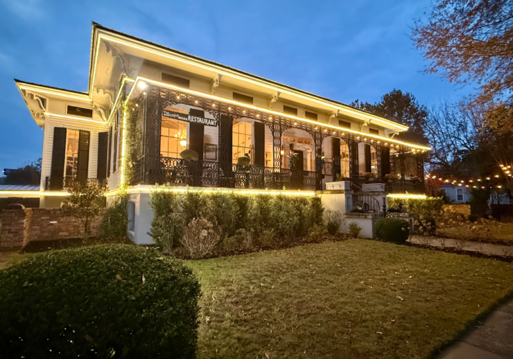 Historic home with decorative lights