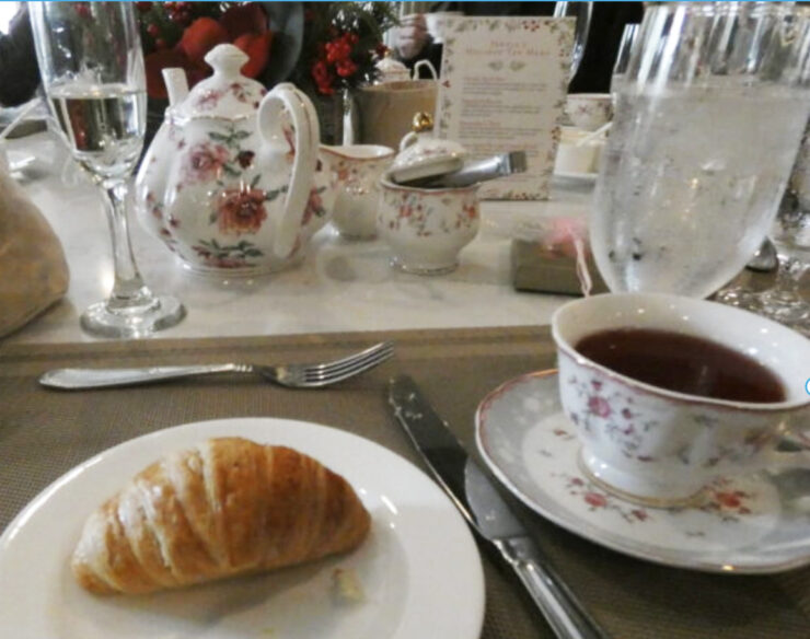 Croissant and cup of tea for the Gilded Era Afternoon Tea