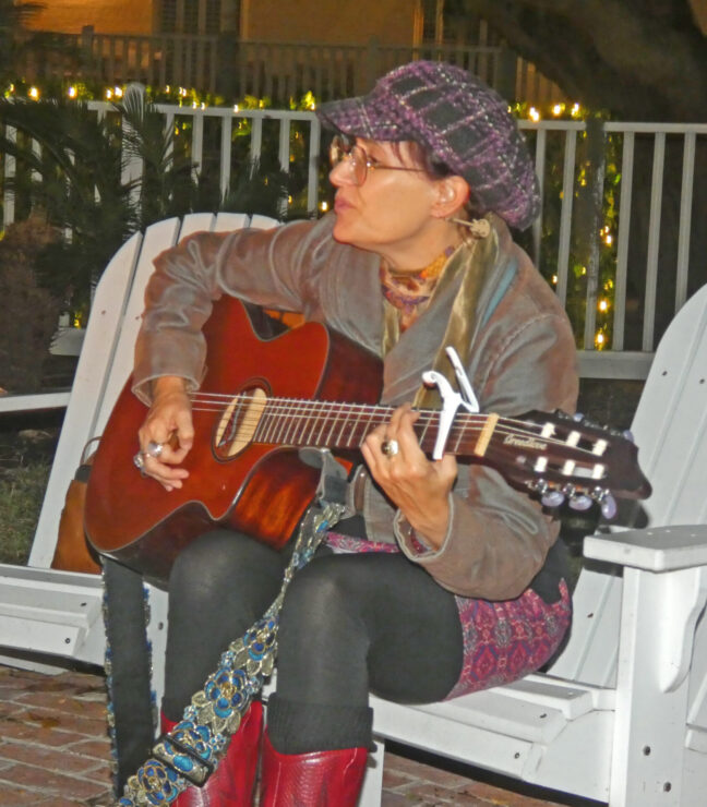 Woman playing a guitar