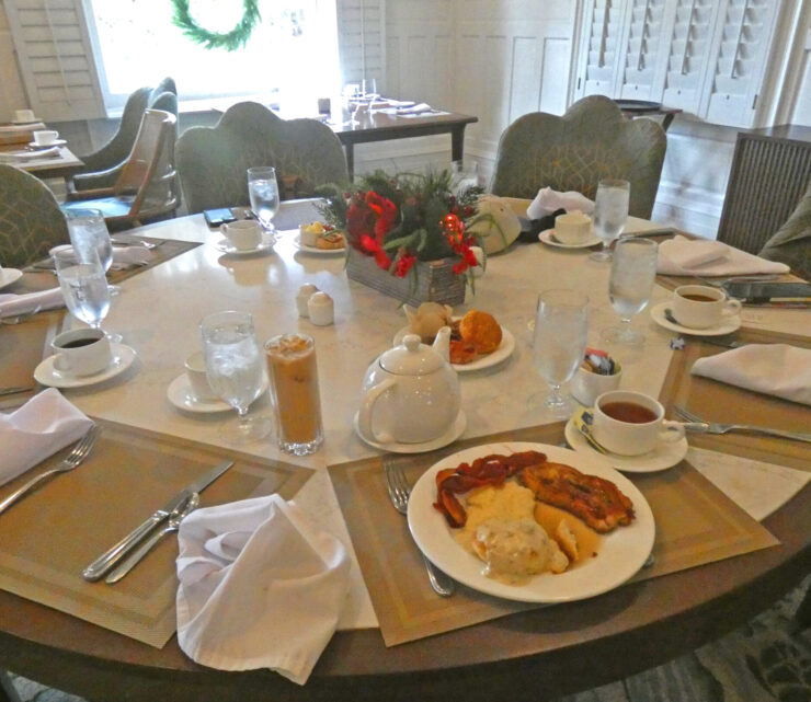 An elegant round table set for breakfast in the Grand Dining Room.