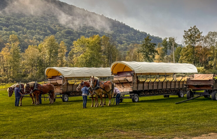 cloud cover of the hills with a covered wagon in the foreground