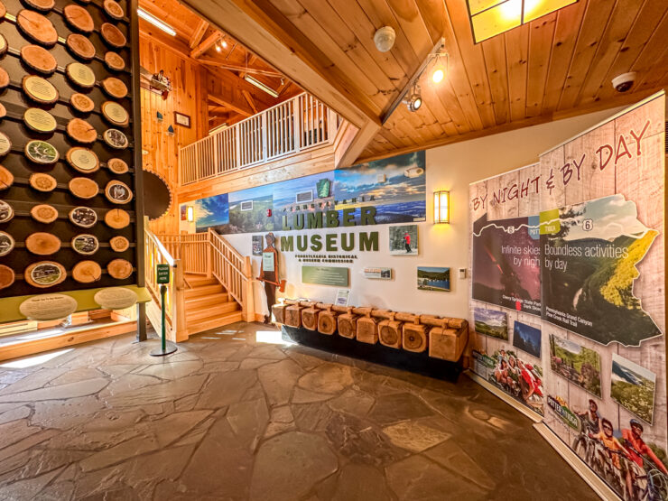 Interior of Lumber Museum with educational displays set in a wood paneled room
