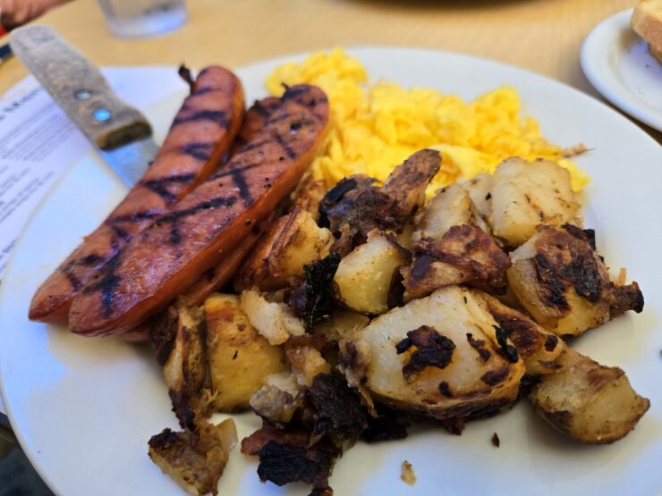 Breakfast plate of sausage, eggs, and potatoes at the Hidden Cafe in Camarillo.