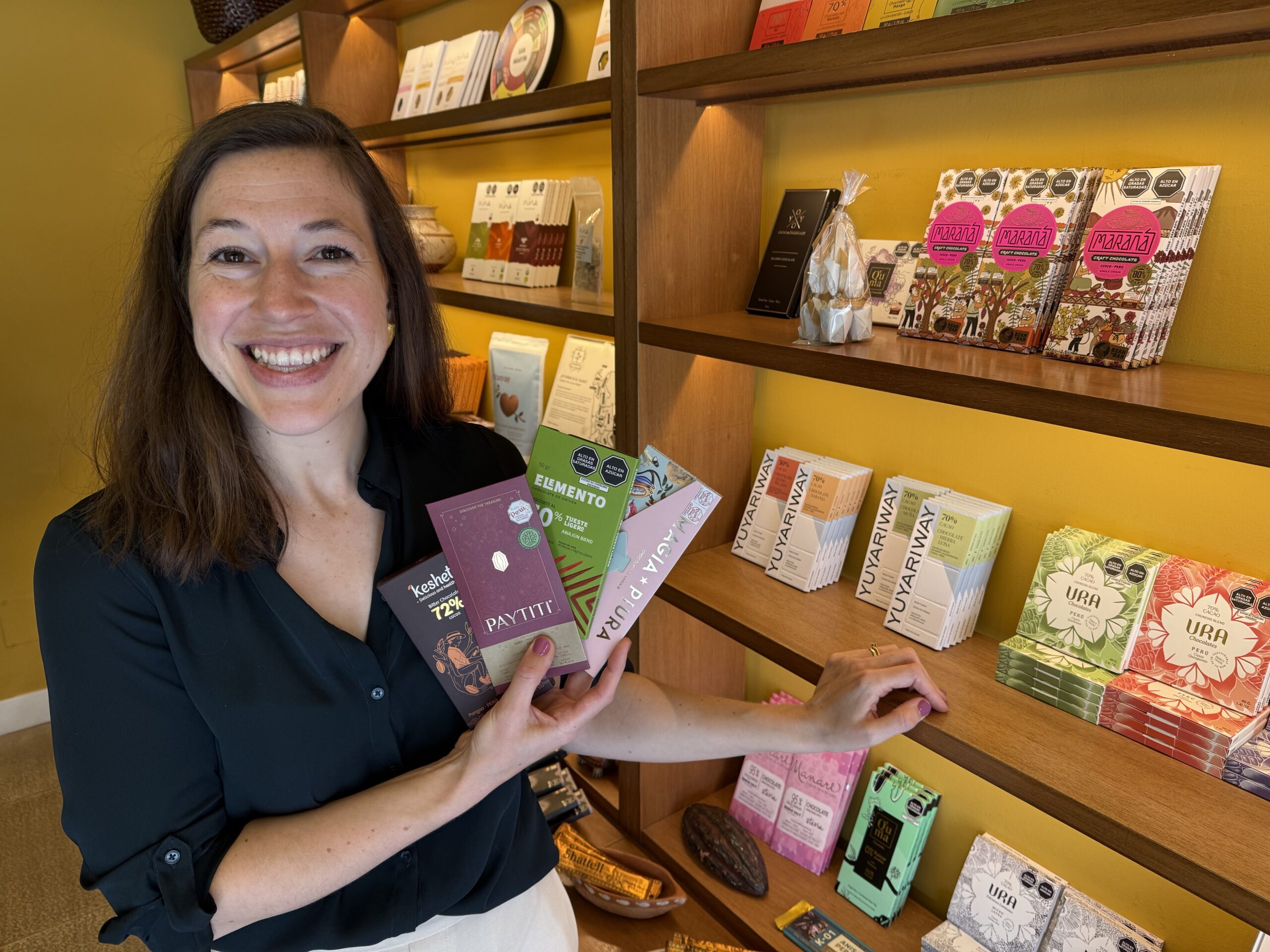 Amanda Jo Wildey American-born Amanda Jo Wildey displays some of the hard-to-find artisan Peruvian chocolate available at Ciclos Café and El Cacaotal in the Barranco district of Lima. @Linda Barnard