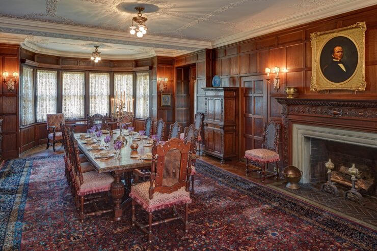 This photo shows the formal dining room inside Cranbrook House, with all of its ornate furnishings and bay windows