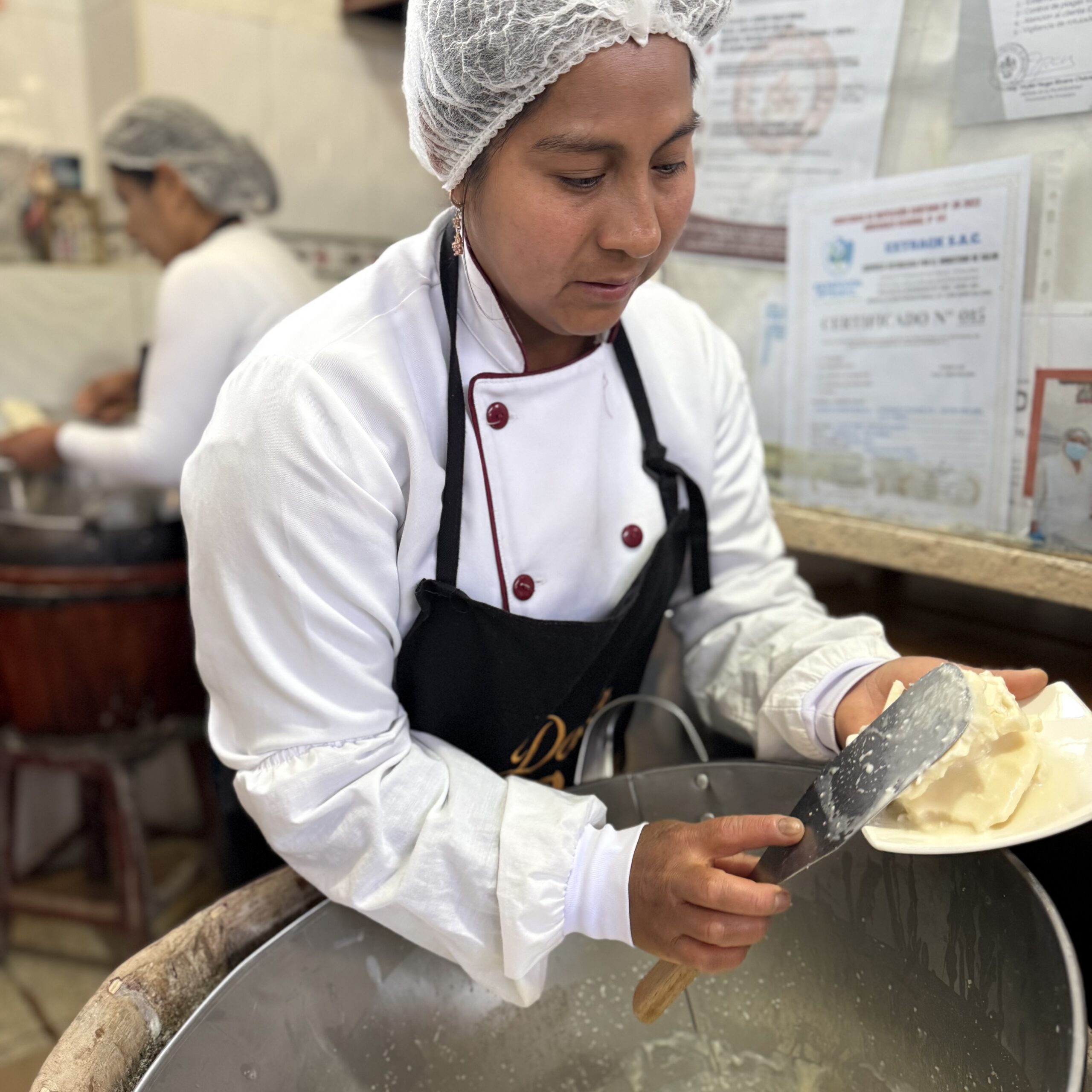 Queseohelado A vendor at the Doña Rosa queso helado stall in historic San Camilo Market in Arequipa, Peru makes the sweet frozen dessert that's been bringing customers here since 1948. ©Linda Barnard