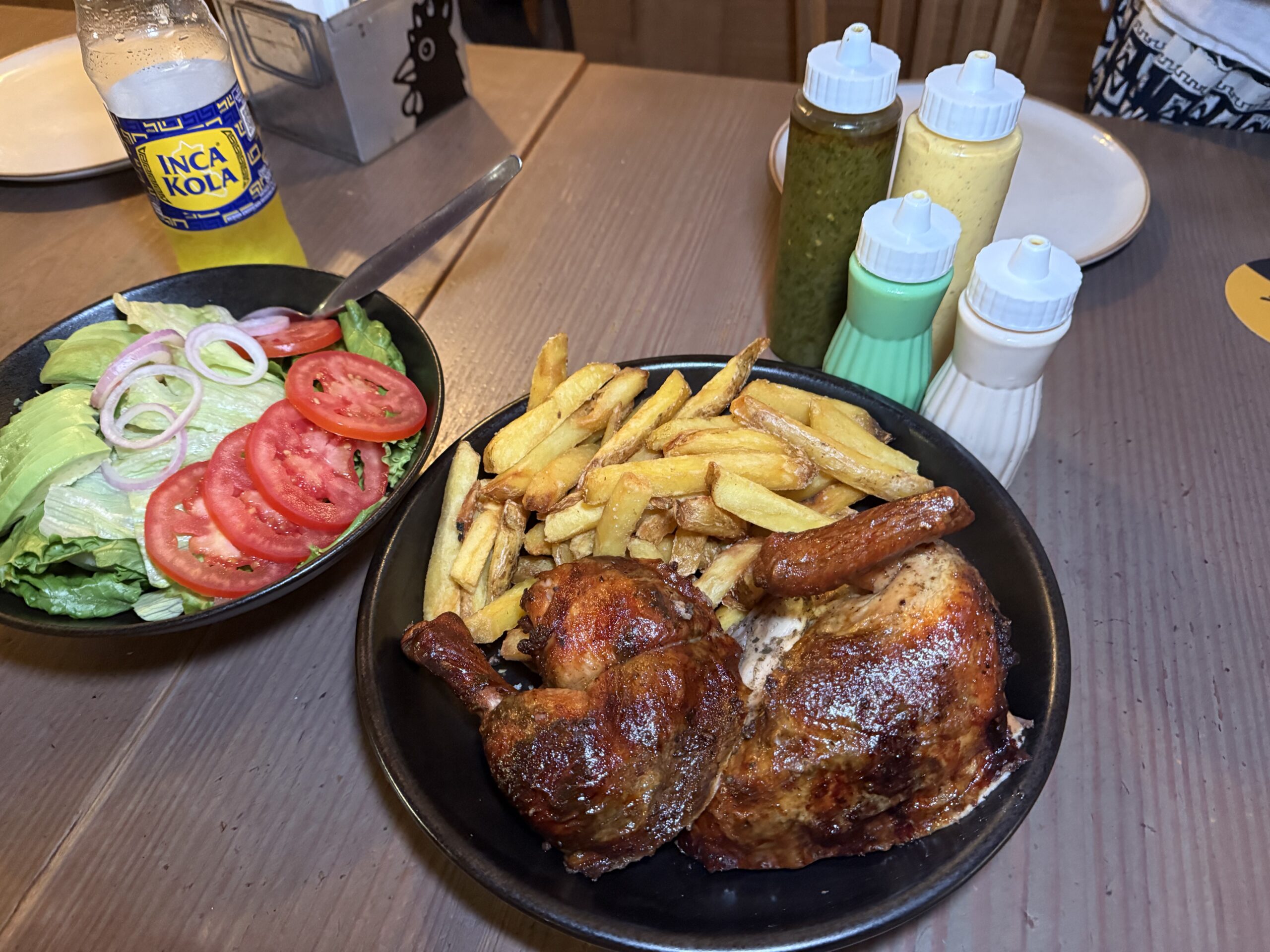 At Tori Polleria, the meal-deal serving of charcoal-grilled rotisserie chicken, comes with fries, salad, sauces and bottles of Inca Cola. ©Linda Barnard