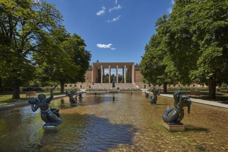 This photo shows the Cranbrook Art Museum and Orpheus Fountain on the grounds.