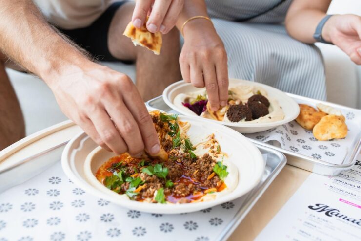 Preparing Middle Eastern cuisine at Babas Hummus House