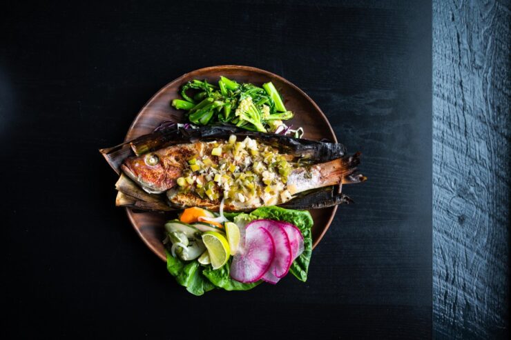 A whole fish cooked on a plate