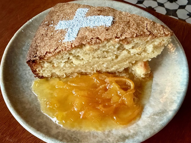 Almond cake with a warm, fresh marmalade sauce.
