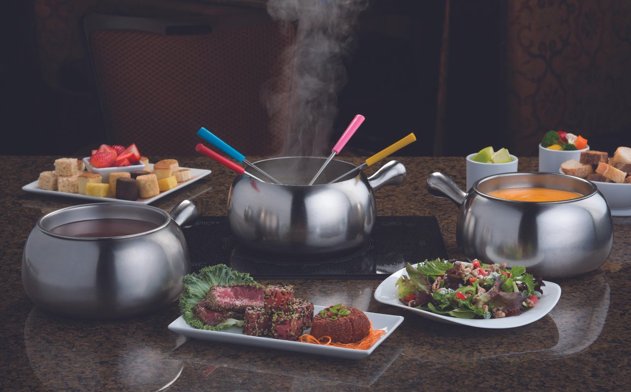 A hotpot and cubed food for cooking in Minneapolis restaurant