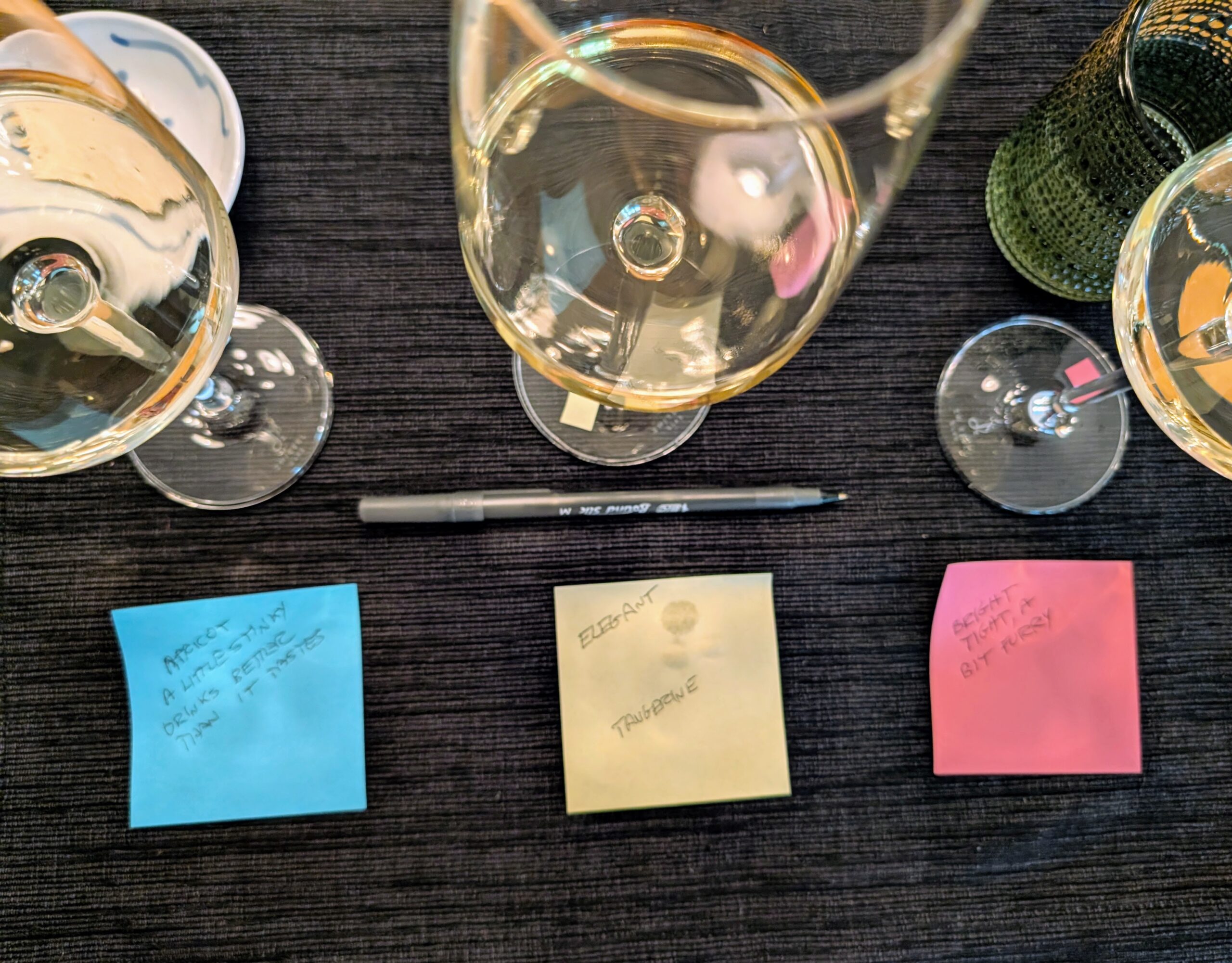 Three glasses of wine with sticky notes