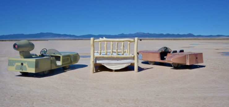 Only at Outpost X does a double bed in the middle of dried up lake bed make sense. ©Julia Bayly