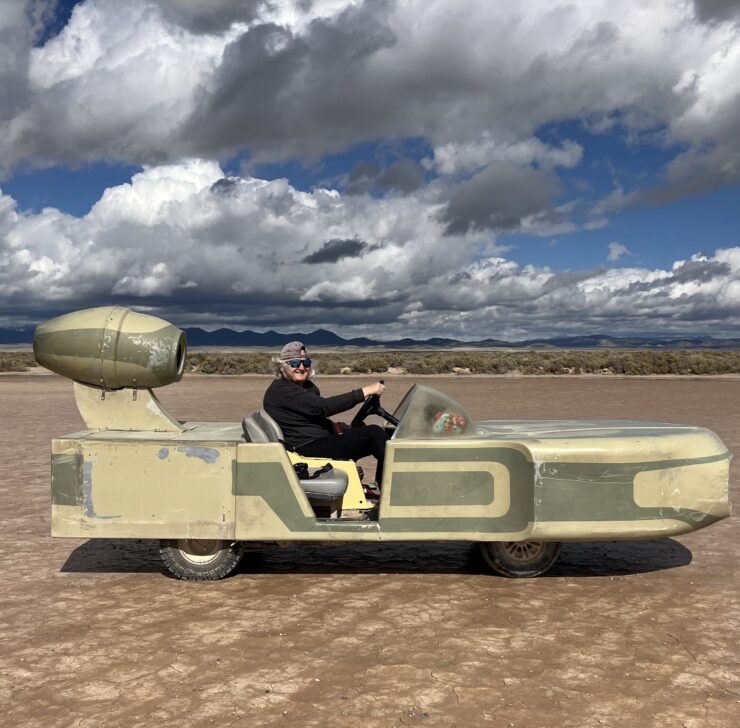 The author takes a sand cruiser for a spin around the dried lakebed of Outpost X. Several of the battery-powered vehicles are provided for guests to enjoy. ©Kim Paradis