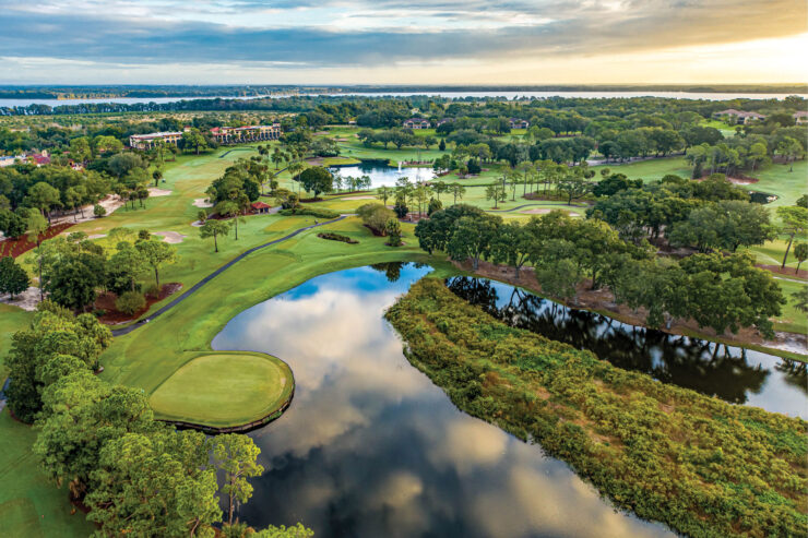 Aerial view of El Campeón golf course at Mission Resort + Club in Howey-in-the-Hills, Florida, with lakes, fairways, trees, and resort grounds.