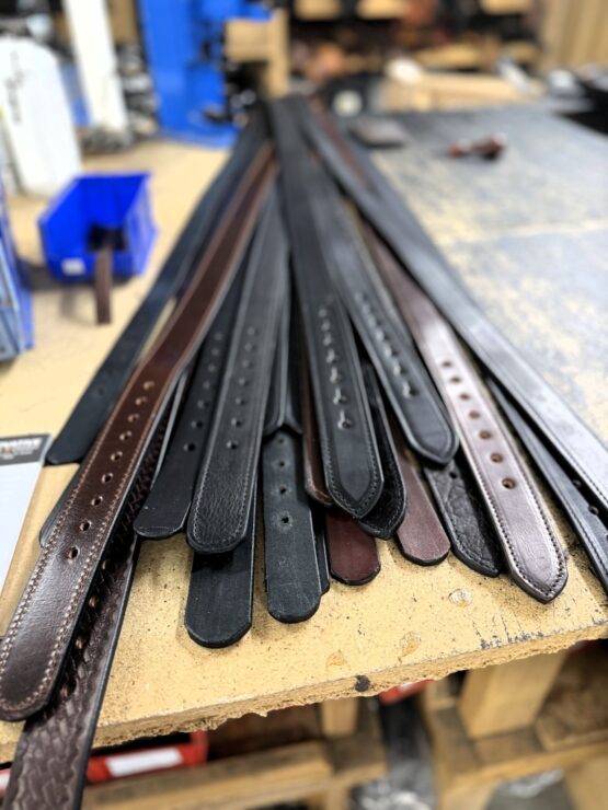 The image shows a variety of handmade leather belts from Silver Star Leather.