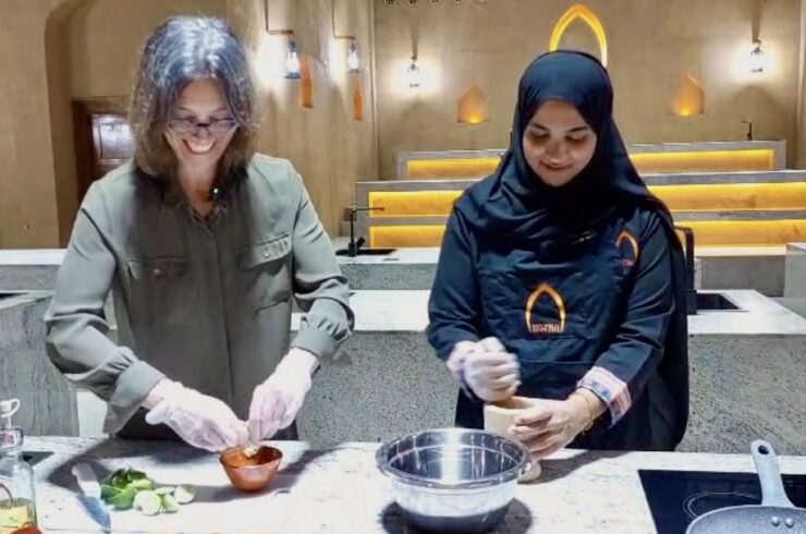 Erin is squeezing limes while Sameera is preparing sardines