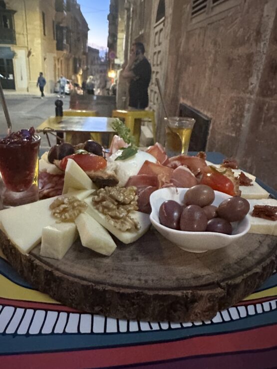 Platters of local cheeses, nuts, olives and cured meats pair with Maltese wines at Why Not wine bar in Valletta, Malta