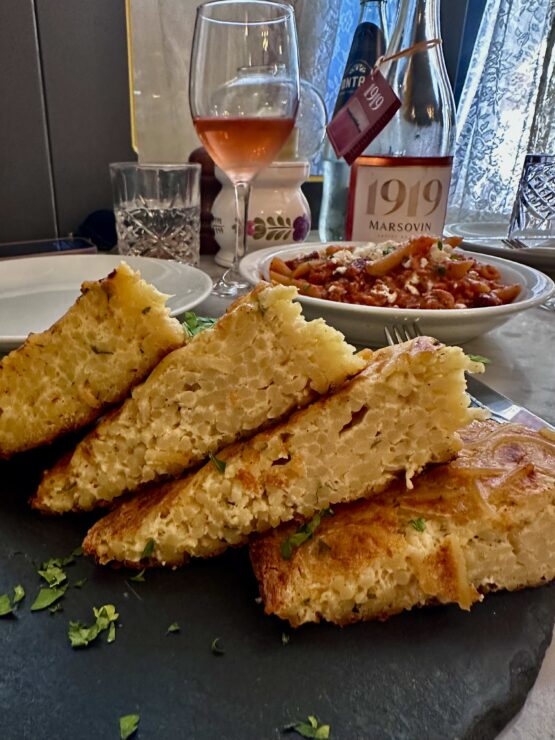 Tarja Moolija, aka spaghetti pie, at Angela's unites spaghetti with eggs, cheese and garlic