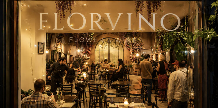 FlorVino's Tasting Room in Hotel Gibbs showing people, tables and chairs and interior decor.