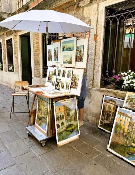 Art stand with paintings for sale on the Venice waterfront