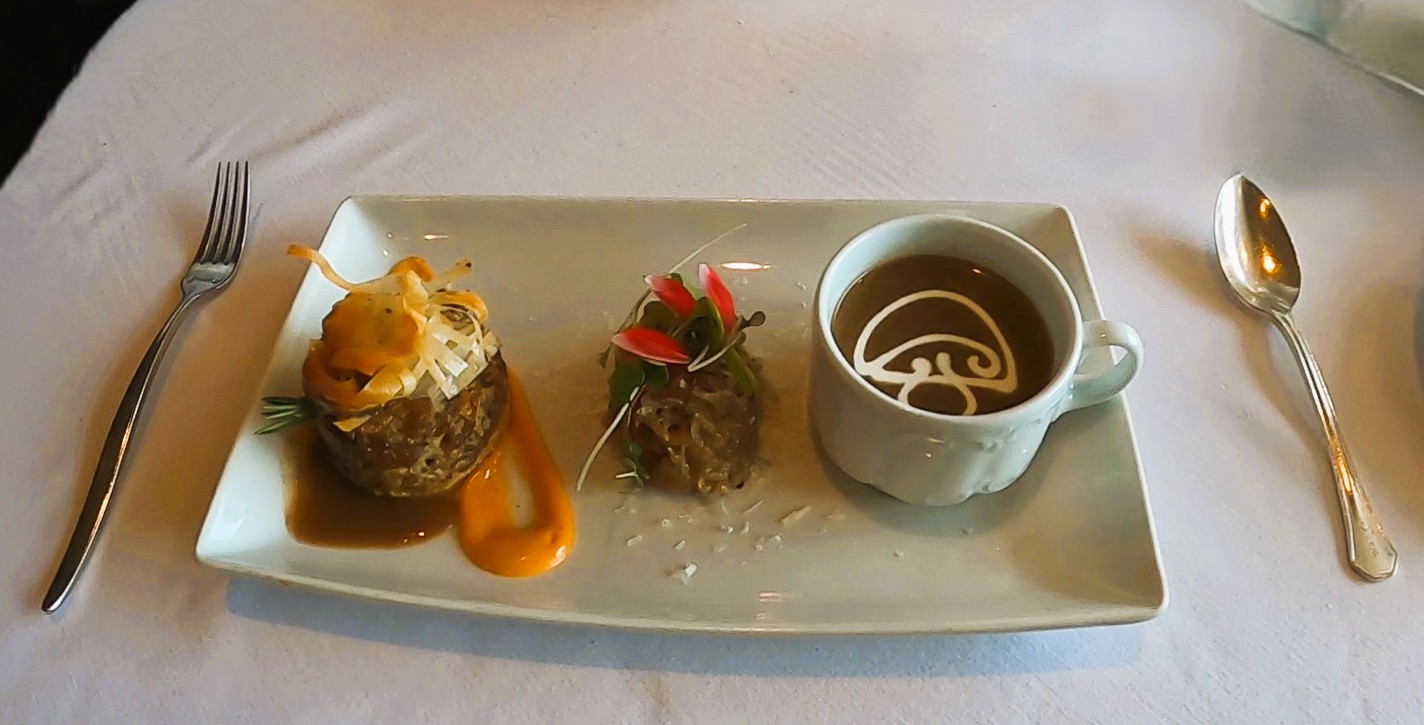 A trio of mushroom items on a white rectangular plate. 