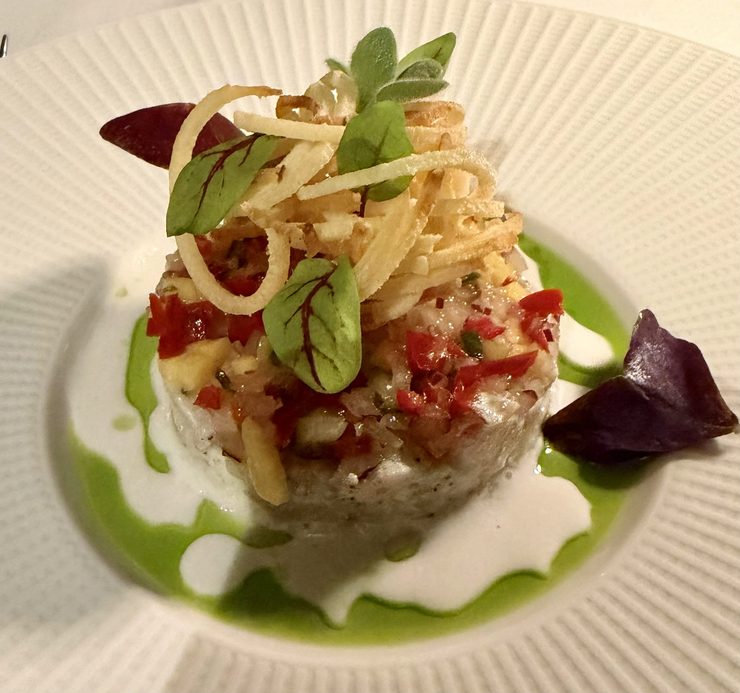 Wahoo ceviche with fried spiral of potato on top at Ingridients restaurant.